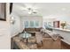 Open-concept living room featuring a sectional sofa, ceiling fan, and view into the dining area at 1601 Thin Pine Dr, Johns Island, SC 29455