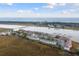 Breathtaking aerial view showcasing coastal beauty and condo complex near beach and boat docks at 166 W Mariners Cay Dr, Folly Beach, SC 29439