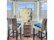 Bright dining area with marsh views and seating for two at 166 W Mariners Cay Dr, Folly Beach, SC 29439
