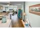 Light and airy condo hallway with view to the living room and waterfront at 166 W Mariners Cay Dr, Folly Beach, SC 29439