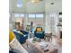 Inviting living room featuring lots of light and beautiful marsh views at 166 W Mariners Cay Dr, Folly Beach, SC 29439