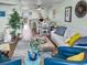 Cozy living room view looking into the dining area and kitchen at 166 W Mariners Cay Dr, Folly Beach, SC 29439
