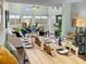 Bright living room with water views, vaulted ceiling, and ample seating at 166 W Mariners Cay Dr, Folly Beach, SC 29439