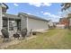 Spacious backyard featuring a brick patio with seating and access to a screened-in porch at 1847 Grovehurst Drive, Charleston, SC 29414