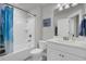 Bright bathroom featuring a shower-tub combo, a large mirror, and a single sink vanity at 1847 Grovehurst Drive, Charleston, SC 29414