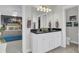 Bathroom with double sinks, black countertop and views of the main bedroom at 1847 Grovehurst Drive, Charleston, SC 29414