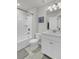 Bright bathroom featuring a shower-tub combo, a large mirror, and a single sink vanity at 1847 Grovehurst Drive, Charleston, SC 29414