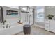 Bright bathroom featuring a soaking tub, glass-enclosed shower, and modern fixtures at 1847 Grovehurst Drive, Charleston, SC 29414