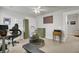 Multi-purpose room with an exercise area, desk with computer, storage and neutral color palette at 1847 Grovehurst Drive, Charleston, SC 29414