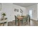 An inviting dining room with a rustic wooden table, six chairs, and natural light at 1847 Grovehurst Drive, Charleston, SC 29414
