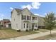 Charming two-story home with a double porch, gray siding, black shutters, and manicured landscaping at 1847 Grovehurst Drive, Charleston, SC 29414