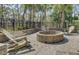 Outdoor fire pit with Adirondack chairs in a landscaped setting at 1847 Grovehurst Drive, Charleston, SC 29414