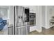 A modern kitchen featuring stainless steel refrigerator and built-in oven and microwave at 1847 Grovehurst Drive, Charleston, SC 29414