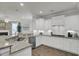 A bright kitchen with white cabinets, granite countertops, stainless steel appliances at 1847 Grovehurst Drive, Charleston, SC 29414