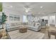 Open-concept living room flows into the kitchen, featuring a plush sofa and stylish decor at 1847 Grovehurst Drive, Charleston, SC 29414