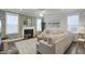 A cozy living room with a fireplace, patterned wallpaper, and comfortable seating at 1847 Grovehurst Drive, Charleston, SC 29414