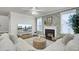 Cozy living room with a fireplace, decorative wallpaper, and plush sofa at 1847 Grovehurst Drive, Charleston, SC 29414
