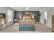 Bright bedroom with a king bed, bench and palm tree decor at 1847 Grovehurst Drive, Charleston, SC 29414