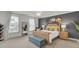 Spacious bedroom with a king bed, bench and beach-themed decor at 1847 Grovehurst Drive, Charleston, SC 29414