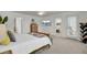 Bright bedroom with a large bed, dresser and access to ensuite bathroom at 1847 Grovehurst Drive, Charleston, SC 29414