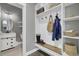 A well-organized mudroom featuring built-in shelving and storage for coats, bags, and shoes at 1847 Grovehurst Drive, Charleston, SC 29414