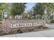 Welcoming Carolina Bay Park sign with brick surround and classic park lighting at 1847 Grovehurst Drive, Charleston, SC 29414