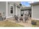 Brick patio area with six chairs and table, a perfect outdoor relaxation spot near the screened porch at 1847 Grovehurst Drive, Charleston, SC 29414