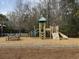 Community playground with a play structure, climbing area, slide, and picnic bench at 1847 Grovehurst Drive, Charleston, SC 29414