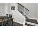 Staircase with wood and white trim, and adjacent dining area at 1847 Grovehurst Drive, Charleston, SC 29414