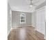 Bedroom with modern ceiling fan, closet, and arched window providing natural light at 1987 Echo Ave, North Charleston, SC 29405