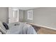 Bright bedroom with wood floors, area rug, and a tray on the bed at 1987 Echo Ave, North Charleston, SC 29405