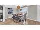 Dining room with modern chandelier, table setting and a large bay window at 1987 Echo Ave, North Charleston, SC 29405