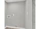 Dedicated laundry space with gray walls and connections for dryer at 1987 Echo Ave, North Charleston, SC 29405