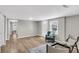 Spacious living room with multiple entry ways and new wood flooring at 1987 Echo Ave, North Charleston, SC 29405