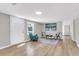 Cozy living room with front door, light-colored floors, and bright, natural light at 1987 Echo Ave, North Charleston, SC 29405