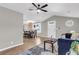 Open concept living room features vaulted ceilings, ceiling fan, and wood-look floors at 1987 Echo Ave, North Charleston, SC 29405