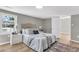 Comfortable main bedroom with large window and neutral color palette at 1987 Echo Ave, North Charleston, SC 29405