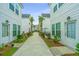 Charming street with a lush walkway lined by modern homes and manicured shrubbery at 2001 E Patterson Pt, Hanahan, SC 29410