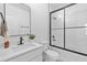 Modern bathroom features white vanity, black hardware, and a shower with black frame at 2008 Emden St, North Charleston, SC 29406