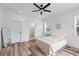 Spacious primary bedroom features a ceiling fan, ample natural light, and wood-style flooring at 2008 Emden St, North Charleston, SC 29406