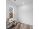 Bright bedroom with wood-look flooring, white walls, and a sunny window with a desk at 2008 Emden St, North Charleston, SC 29406