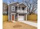 Charming two-story home with a gray exterior and a small front balcony at 2008 Emden St, North Charleston, SC 29406