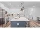 Bright, modern kitchen with large island, white cabinets, and stainless steel appliances at 2008 Emden St, North Charleston, SC 29406