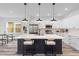 Kitchen island with white countertop, pendant lighting, and stainless steel appliances at 2008 Emden St, North Charleston, SC 29406