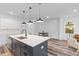 Open kitchen with a large island, pendant lights, and stainless steel appliances at 2008 Emden St, North Charleston, SC 29406