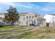 View of the home's backyard featuring a patio area, mature tree, and a well-maintained lawn at 218 Mayfield Dr, Goose Creek, SC 29445