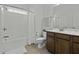 Cozy bathroom featuring a shower-tub combo and wood cabinets for a functional and comfortable experience at 218 Mayfield Dr, Goose Creek, SC 29445