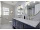 Elegant bathroom with double vanity, marble countertop, and stylish gold framed mirrors at 218 Mayfield Dr, Goose Creek, SC 29445