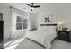 Tranquil bedroom featuring a queen bed, soft carpet, bright window, and serene decor for restful nights and peaceful mornings at 218 Mayfield Dr, Goose Creek, SC 29445