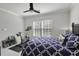Well-lit bedroom includes a stationary bike and weights for convenient in-home fitness at 218 Mayfield Dr, Goose Creek, SC 29445